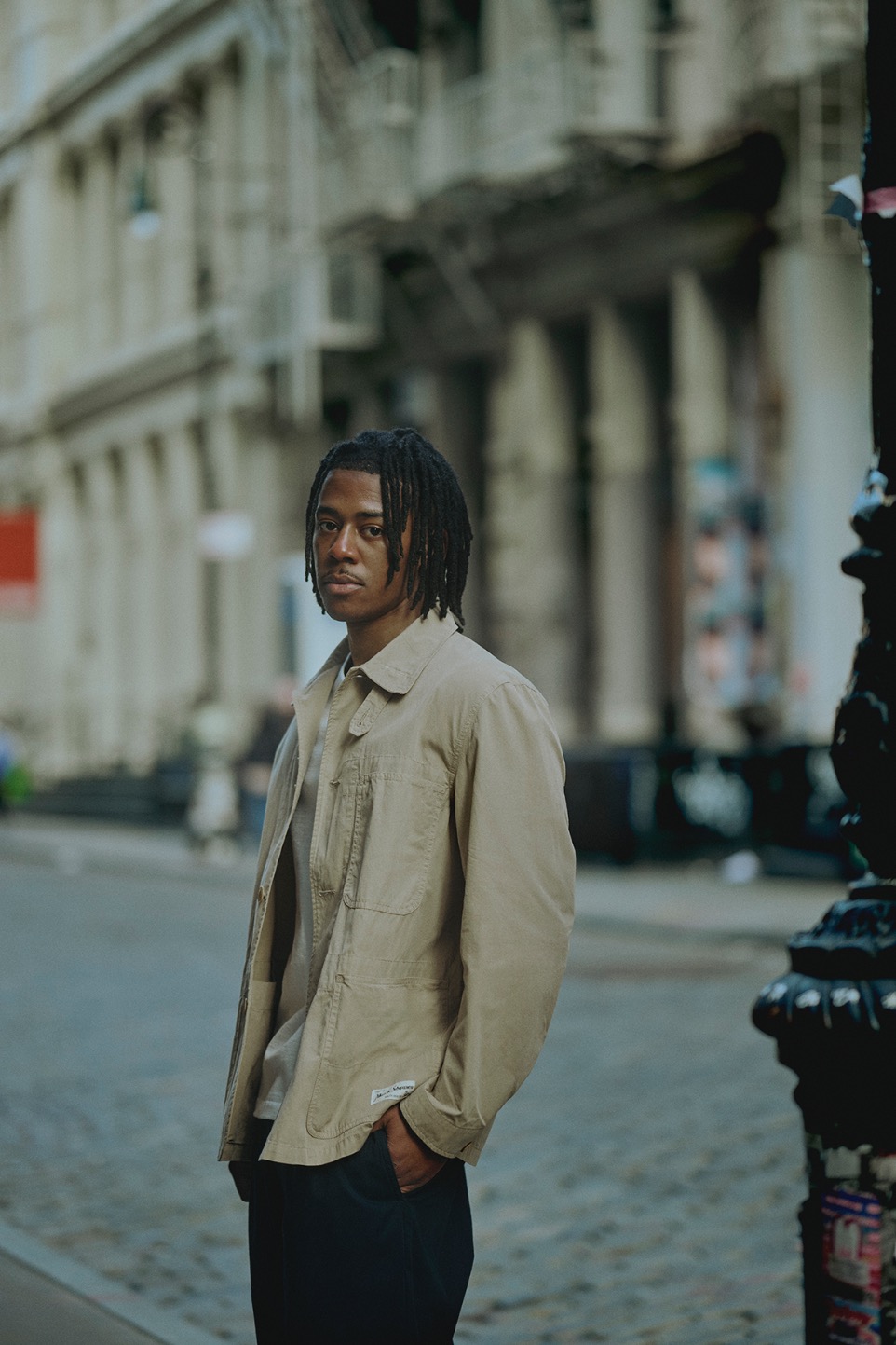 man wearing khaki jacket in the streets of New York 