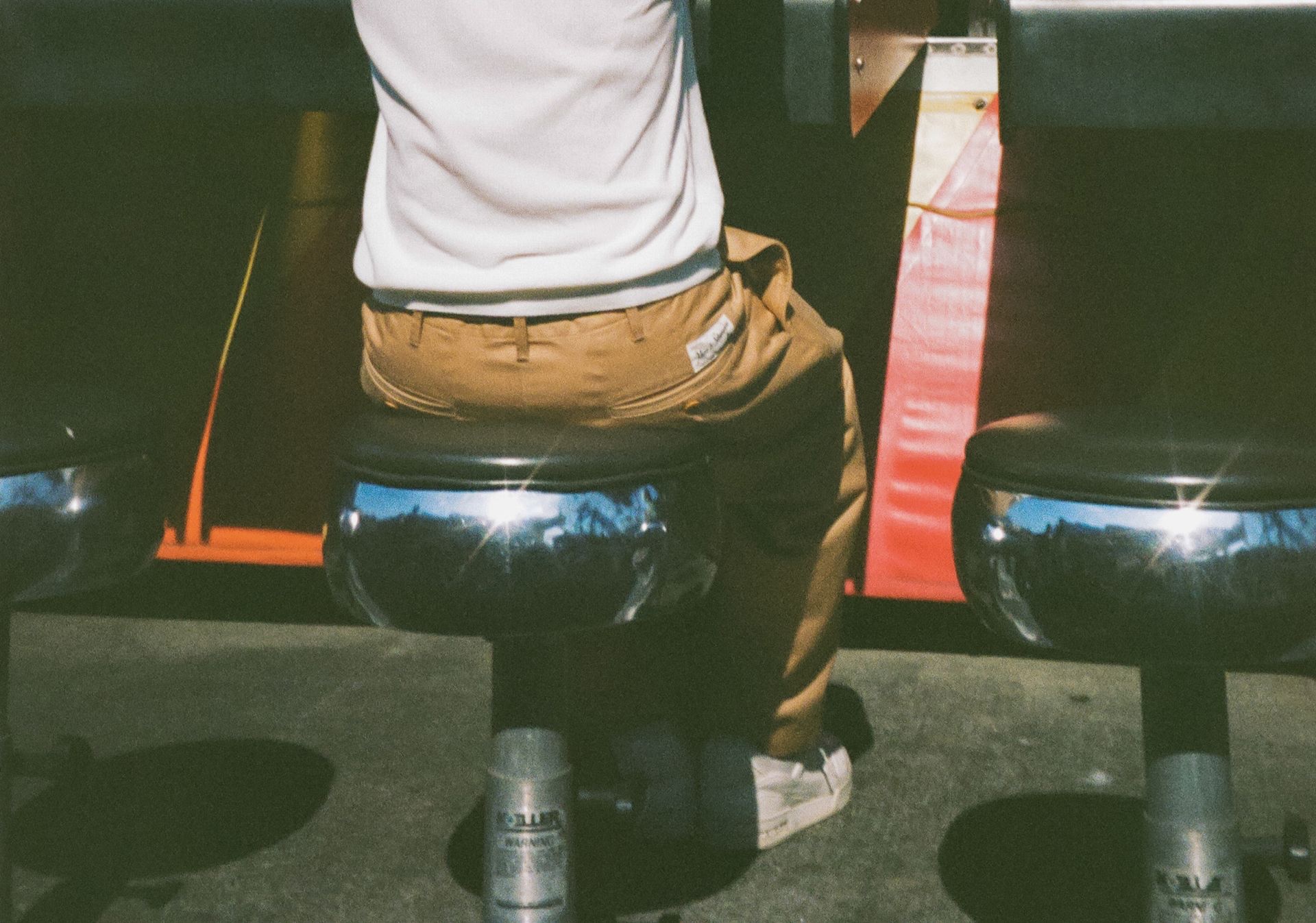 Closeup of a man sitting at a vending machine